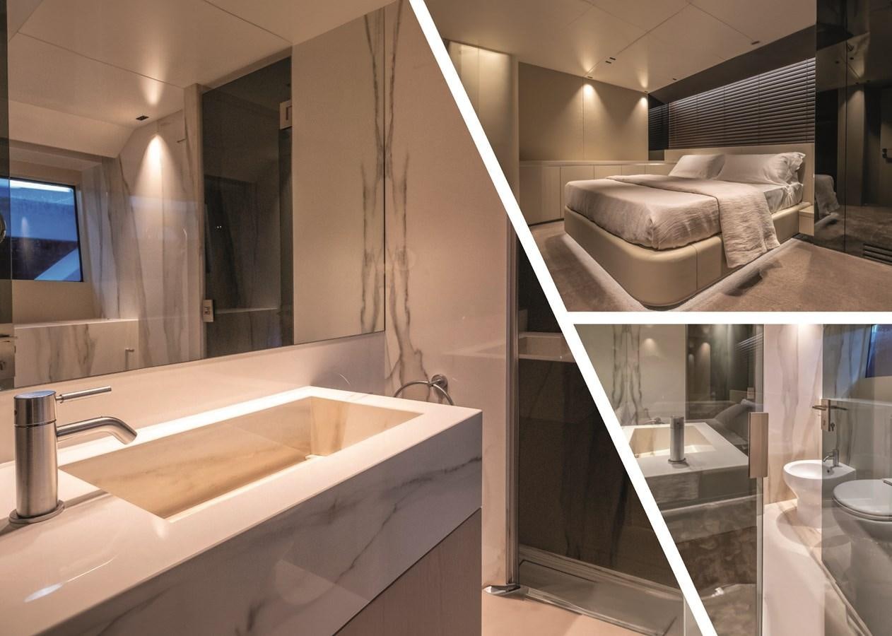 a bathroom with a large mirror aboard NADA Yacht for Sale