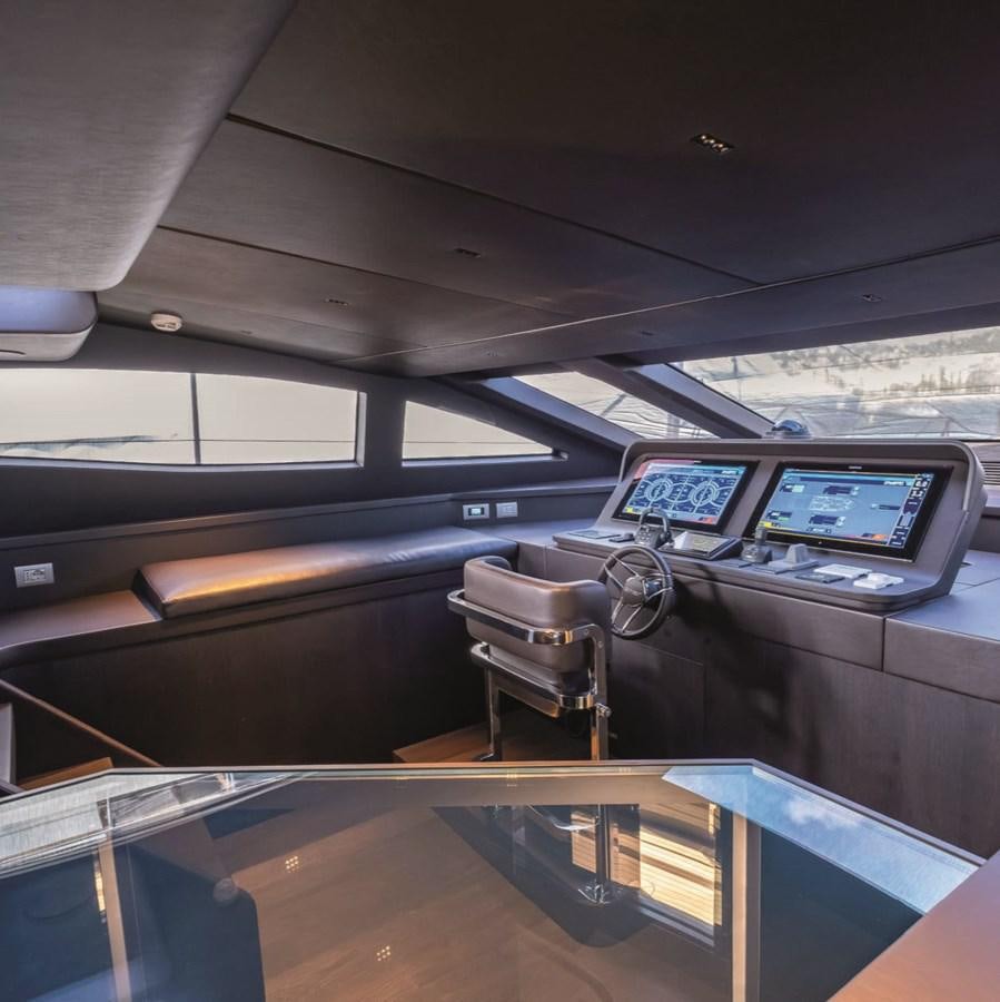 a bus with a laptop on the seat aboard NADA Yacht for Sale