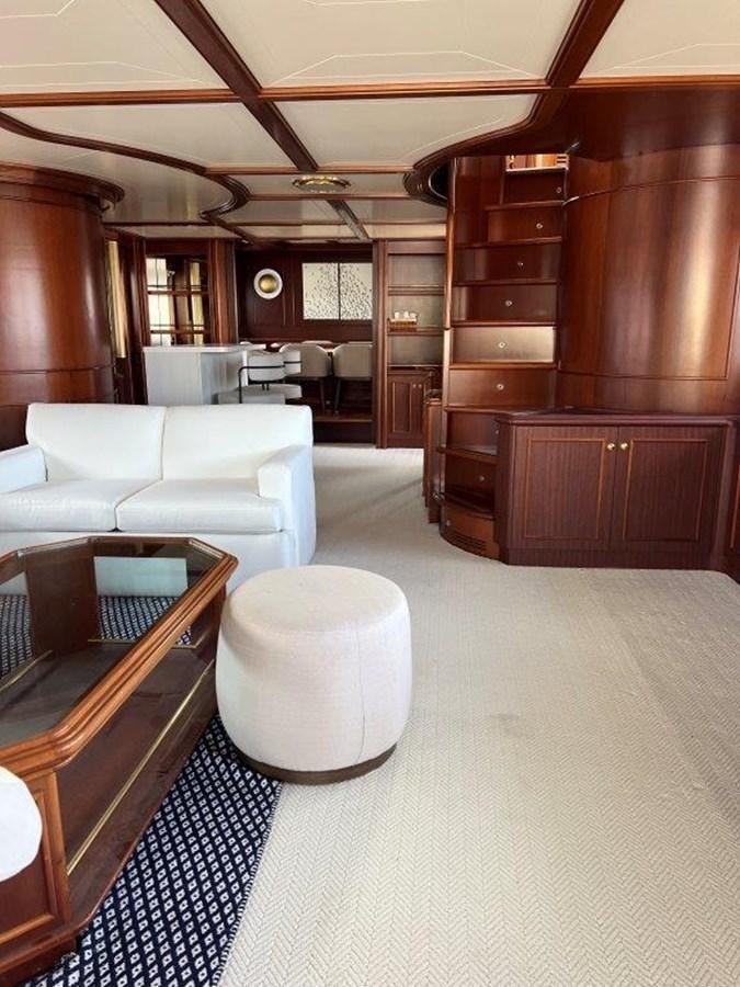 a room with a couch and a table aboard MYEERAH Yacht for Sale