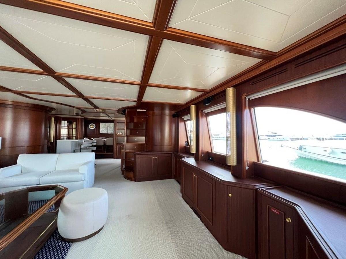 a room with a couch and a table aboard MYEERAH Yacht for Sale