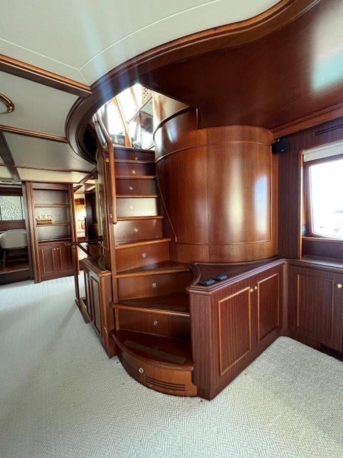 a wooden cabinet in a room aboard MYEERAH Yacht for Sale