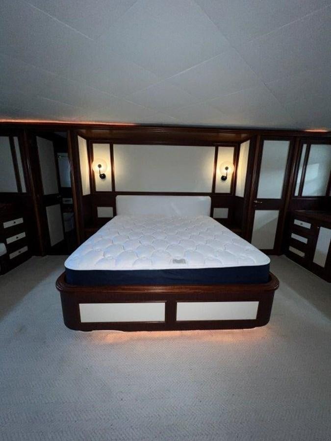 a bed in a room aboard MYEERAH Yacht for Sale