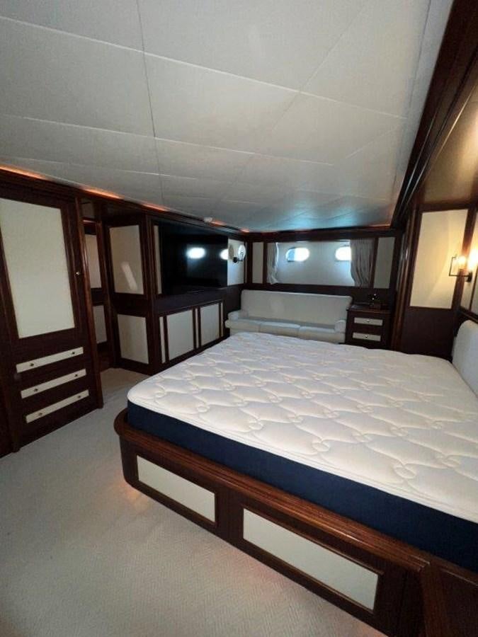 a bed in a room aboard MYEERAH Yacht for Sale