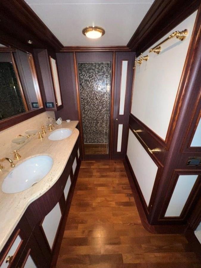 a bathroom with a sink and a mirror aboard MYEERAH Yacht for Sale