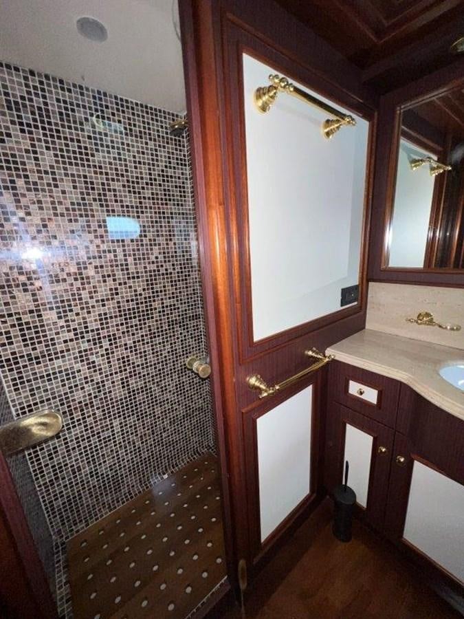a bathroom with a shower curtain aboard MYEERAH Yacht for Sale