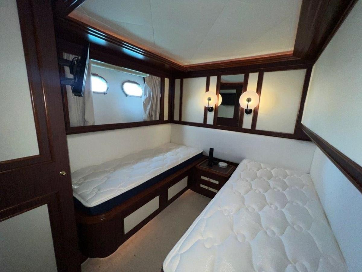 a room with two beds aboard MYEERAH Yacht for Sale