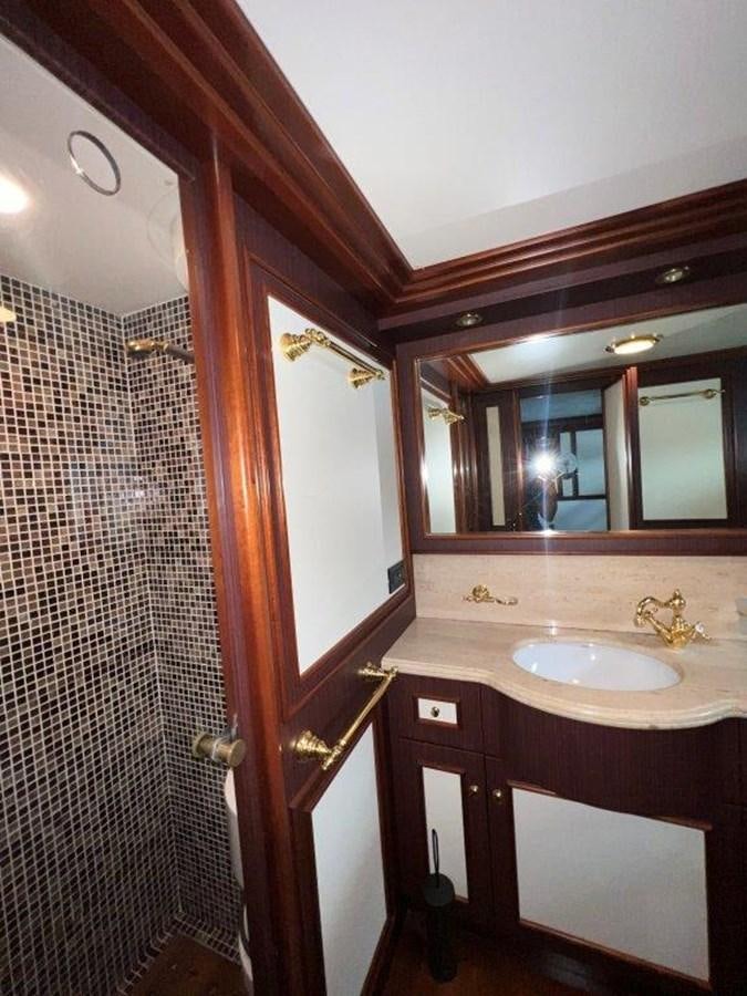 a bathroom with a sink and a mirror aboard MYEERAH Yacht for Sale
