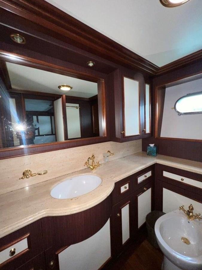 a bathroom with a large mirror aboard MYEERAH Yacht for Sale