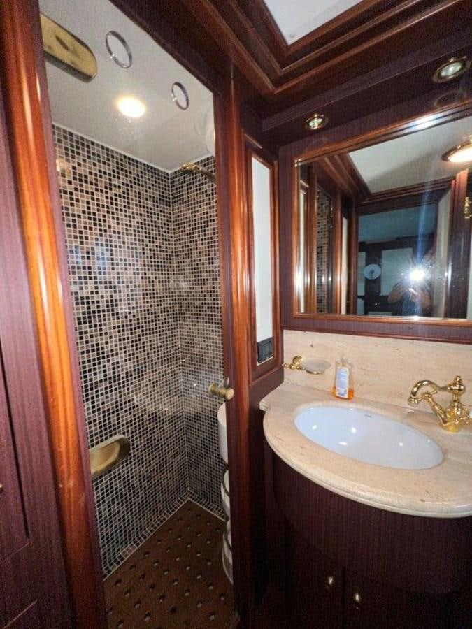 a bathroom with a sink and a shower aboard MYEERAH Yacht for Sale