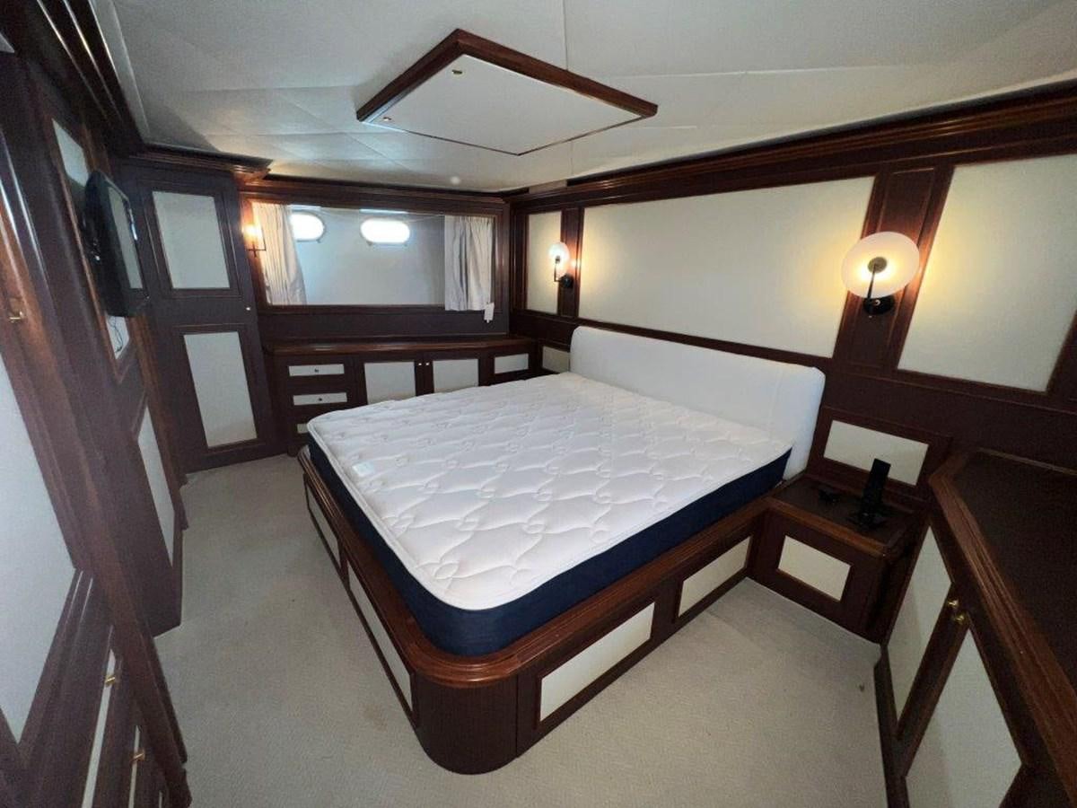 a bed in a room aboard MYEERAH Yacht for Sale