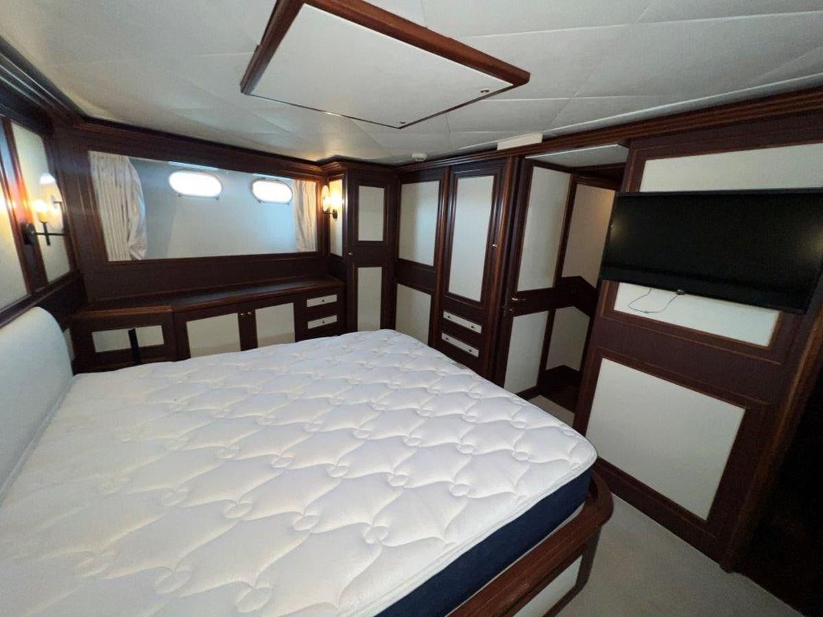 a bed in a room aboard MYEERAH Yacht for Sale