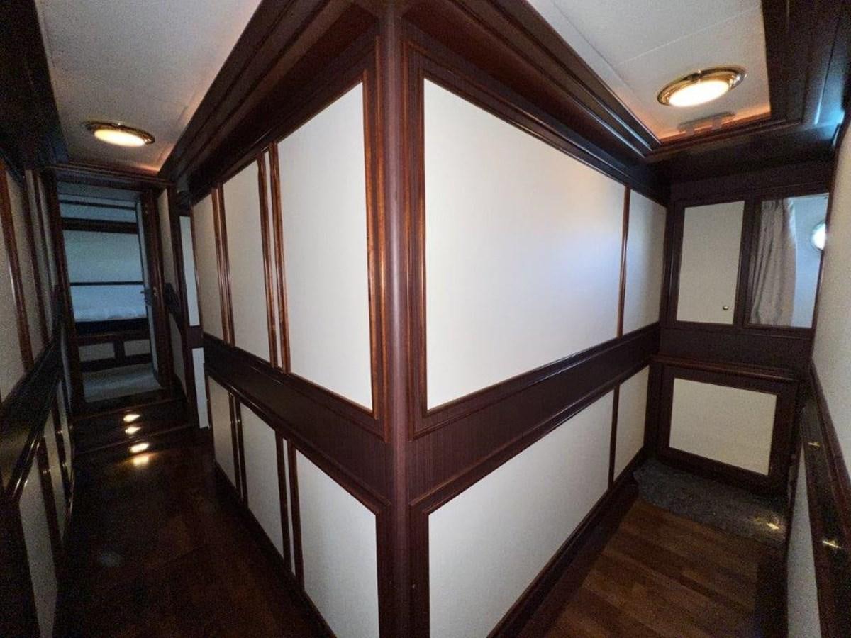 a room with a wood door aboard MYEERAH Yacht for Sale