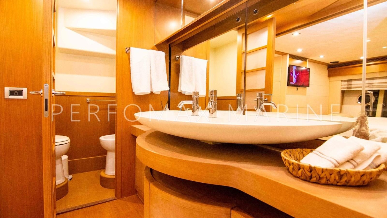 a bathroom with a large mirror aboard F78 Yacht for Sale