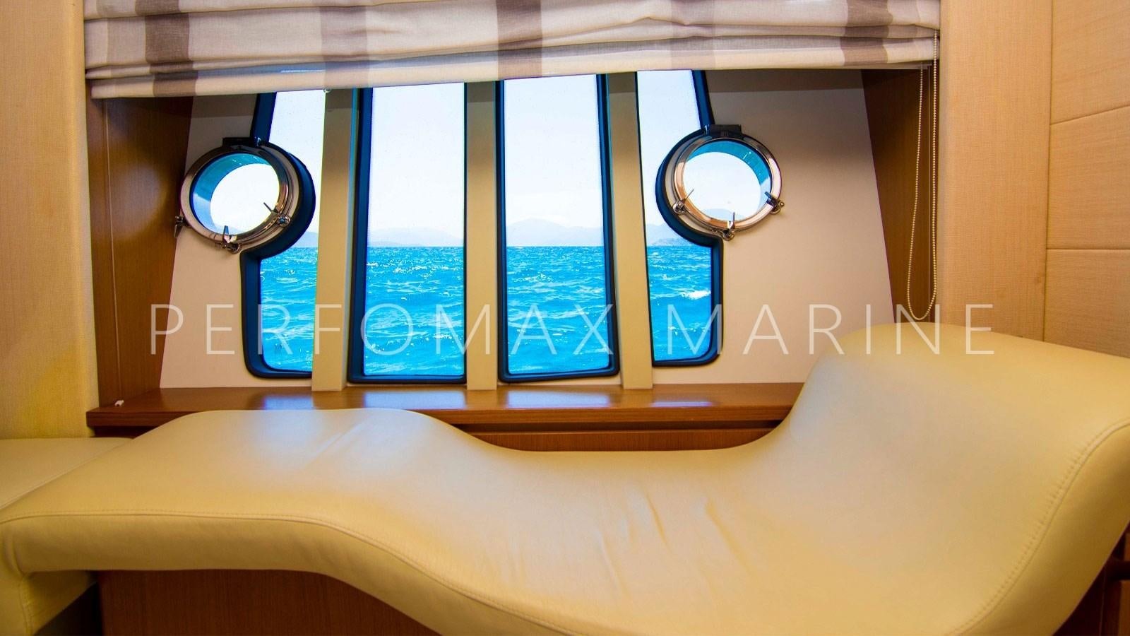 a room with a bed and a window aboard F78 Yacht for Sale
