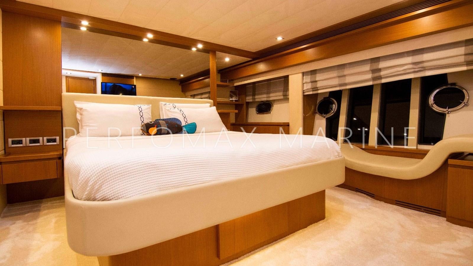 a room with a bed and a fan aboard F78 Yacht for Sale