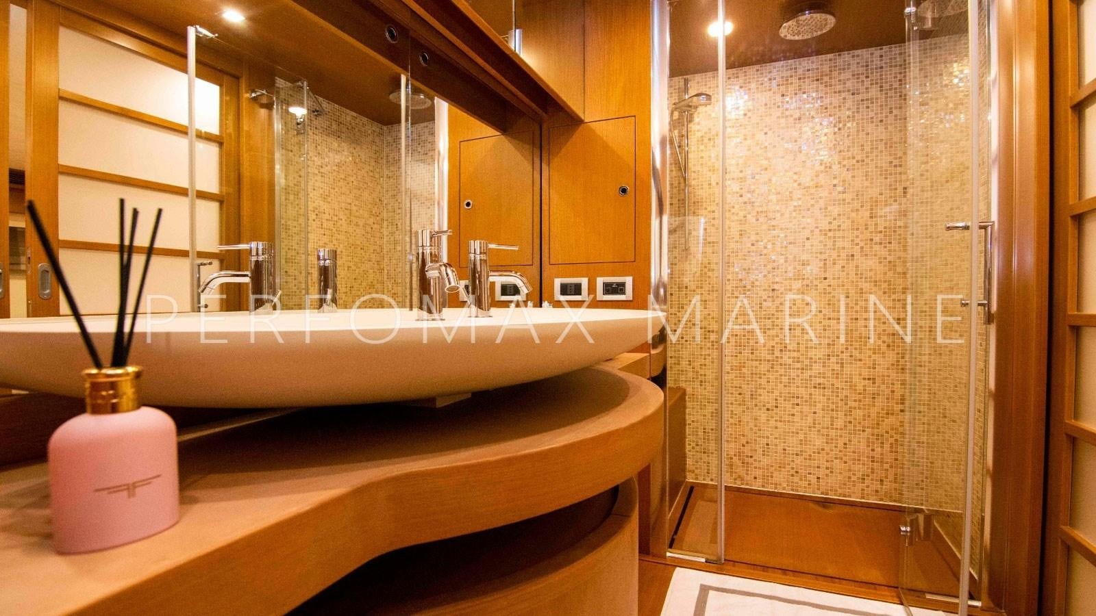 a bathroom with a glass shower aboard F78 Yacht for Sale