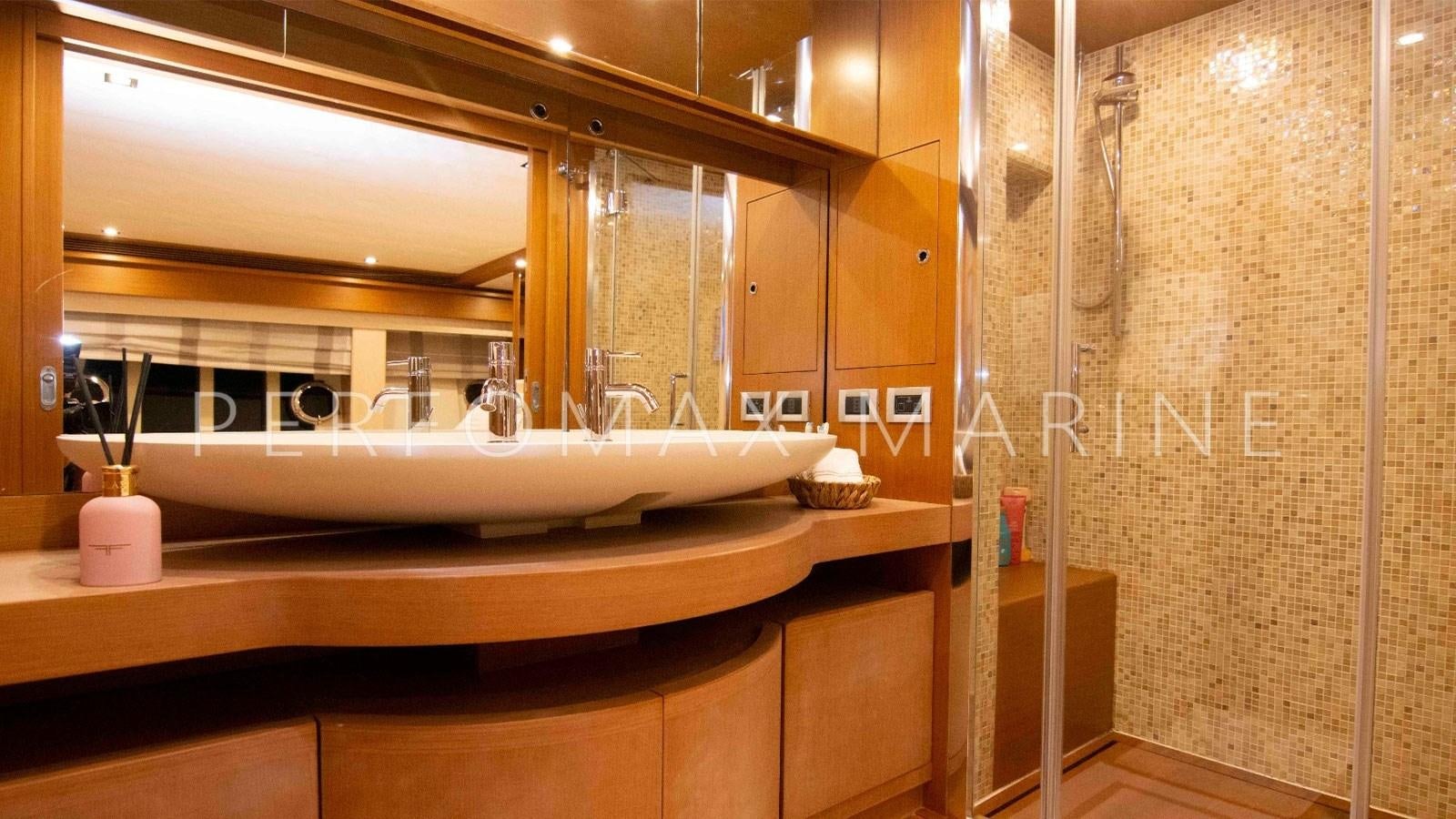 a bathroom with a large mirror aboard F78 Yacht for Sale