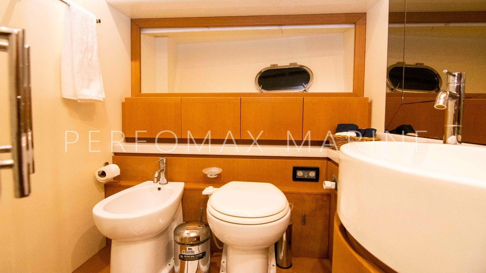 a bathroom with a toilet and sink aboard F78 Yacht for Sale