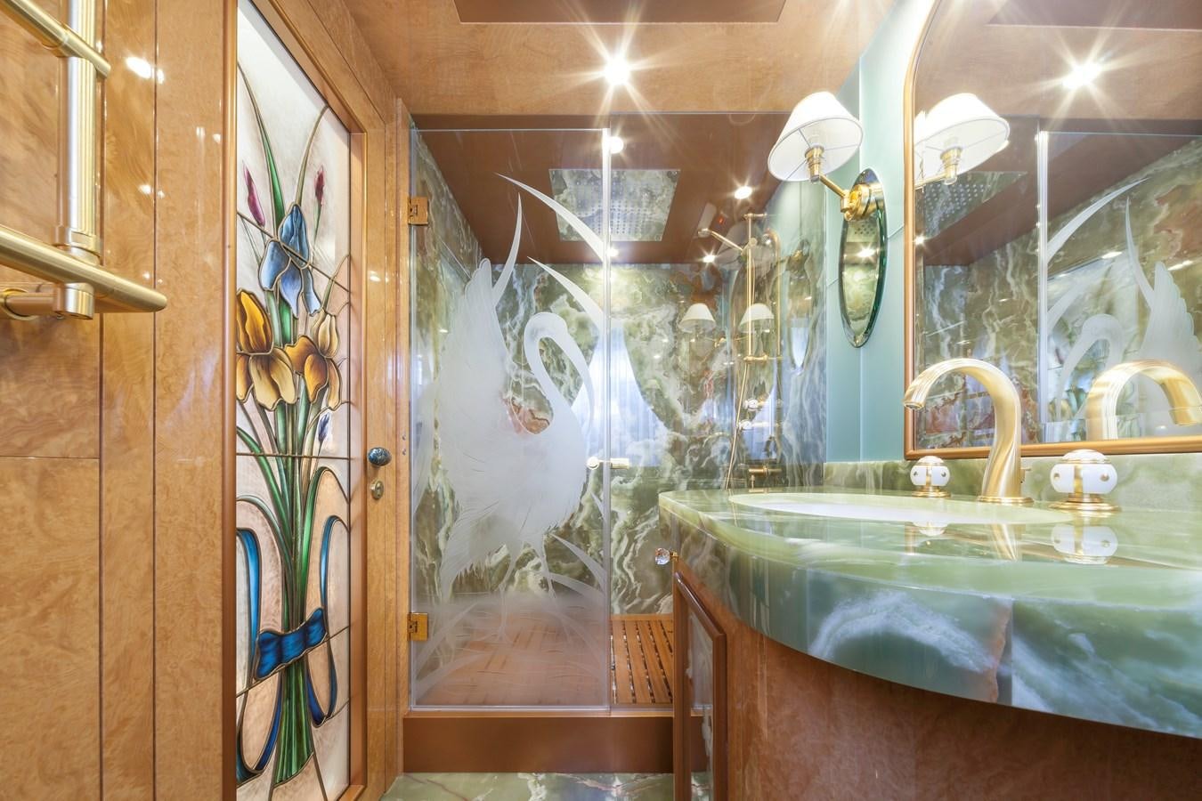 a bathroom with a large blue tub aboard DUCHESSA Yacht for Sale