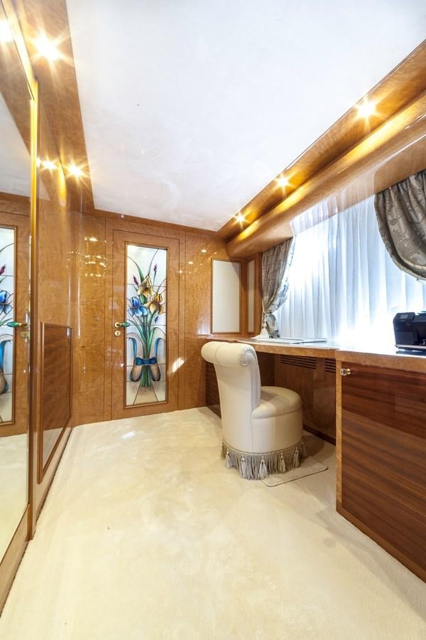a bathroom with a toilet and a window aboard DUCHESSA Yacht for Sale
