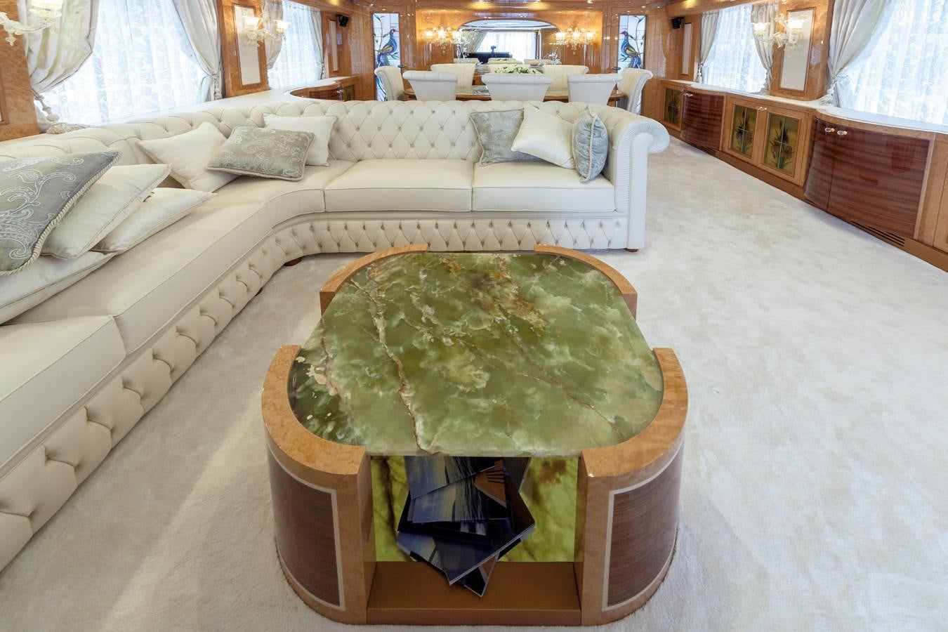 a large room with a bed and a chair aboard DUCHESSA Yacht for Sale