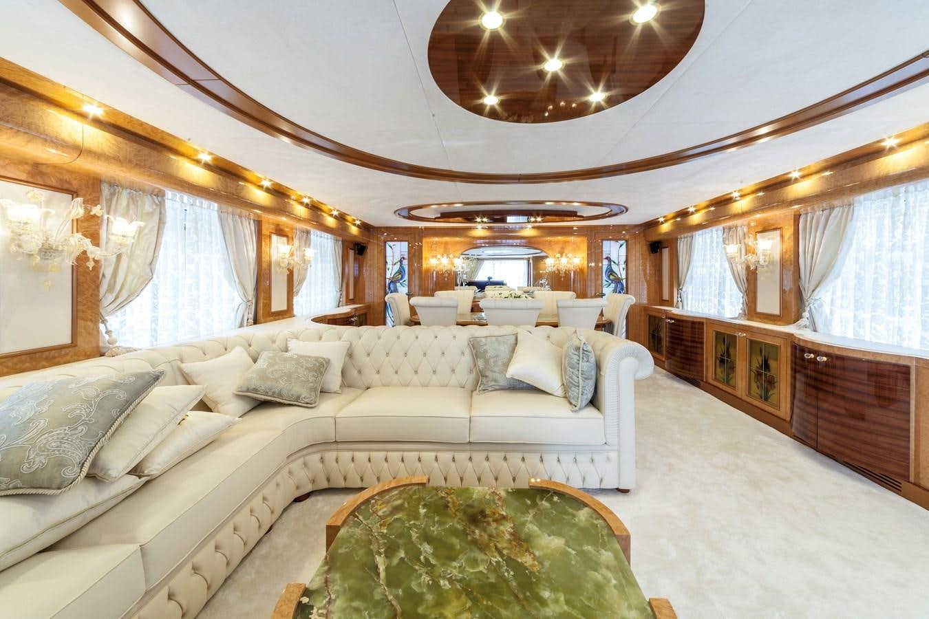 a large room with a bed and a couch aboard DUCHESSA Yacht for Sale