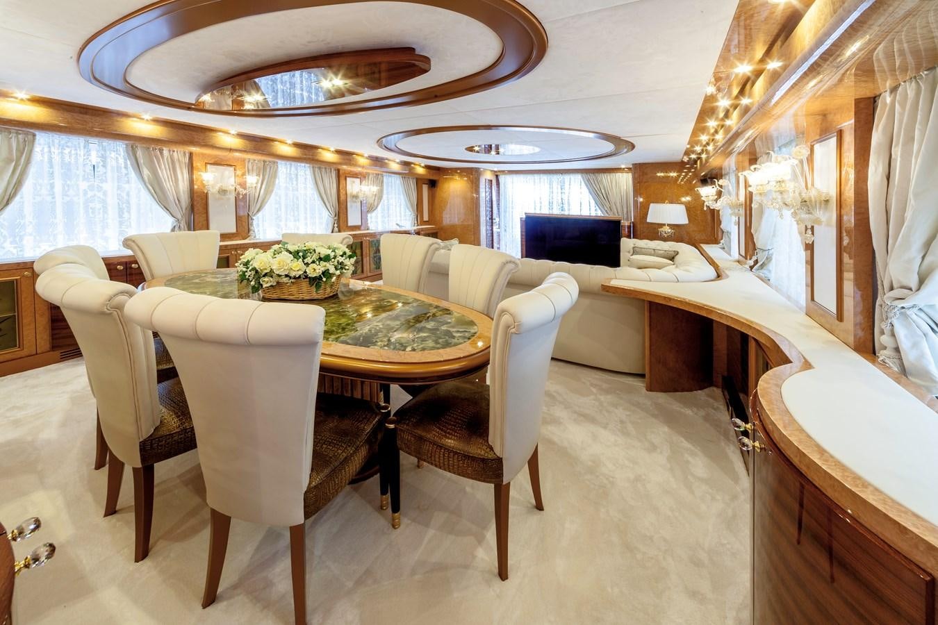 a dining room with a table and chairs aboard DUCHESSA Yacht for Sale