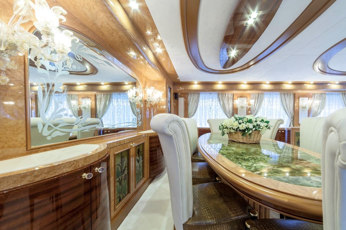 a fancy dining room with a table aboard DUCHESSA Yacht for Sale
