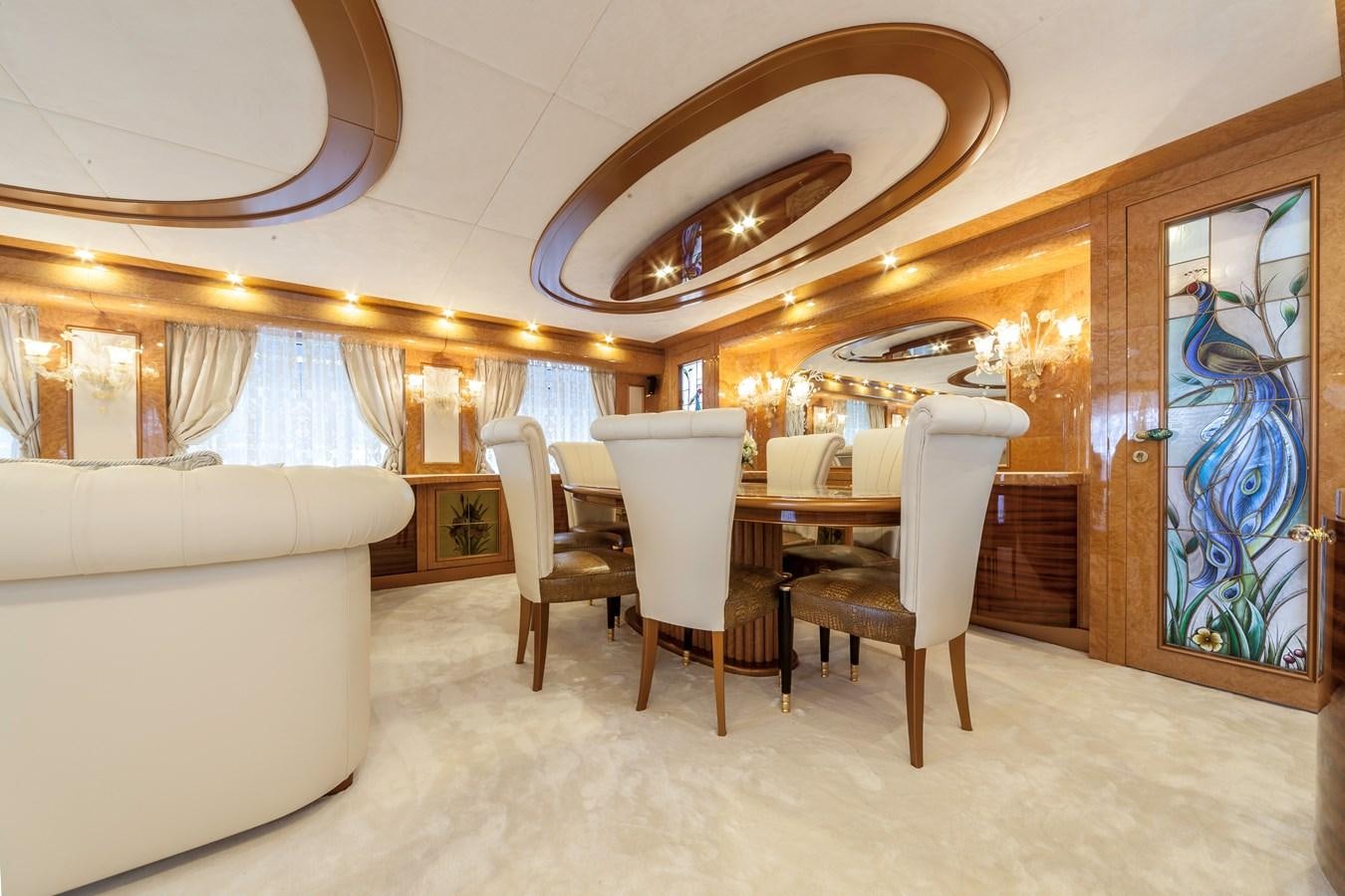 a room with a table and chairs aboard DUCHESSA Yacht for Sale