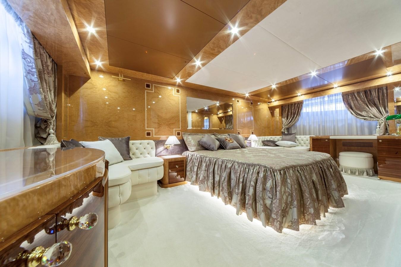 a large bedroom with a large bed aboard DUCHESSA Yacht for Sale