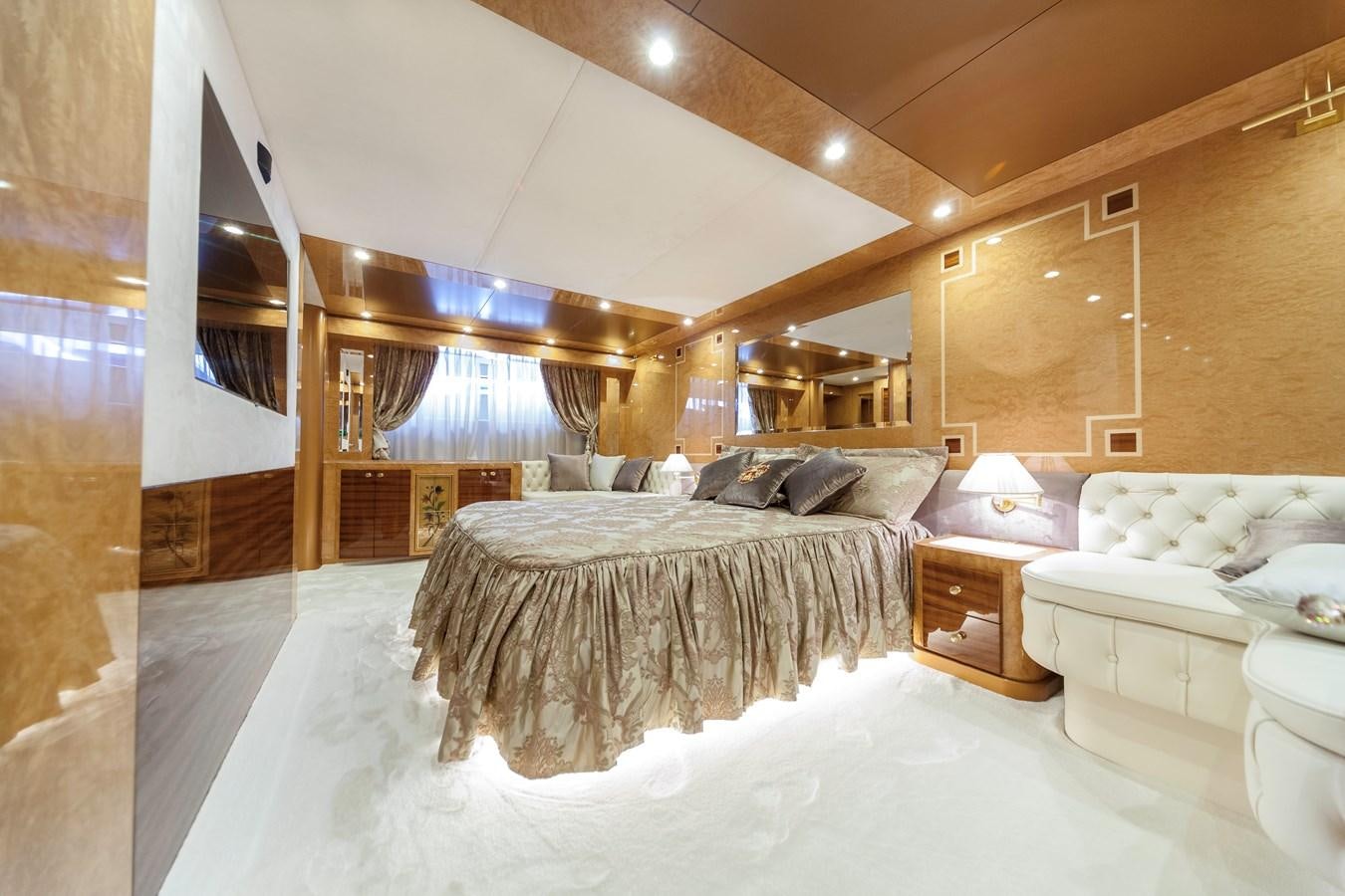 a large bedroom with a large bed aboard DUCHESSA Yacht for Sale