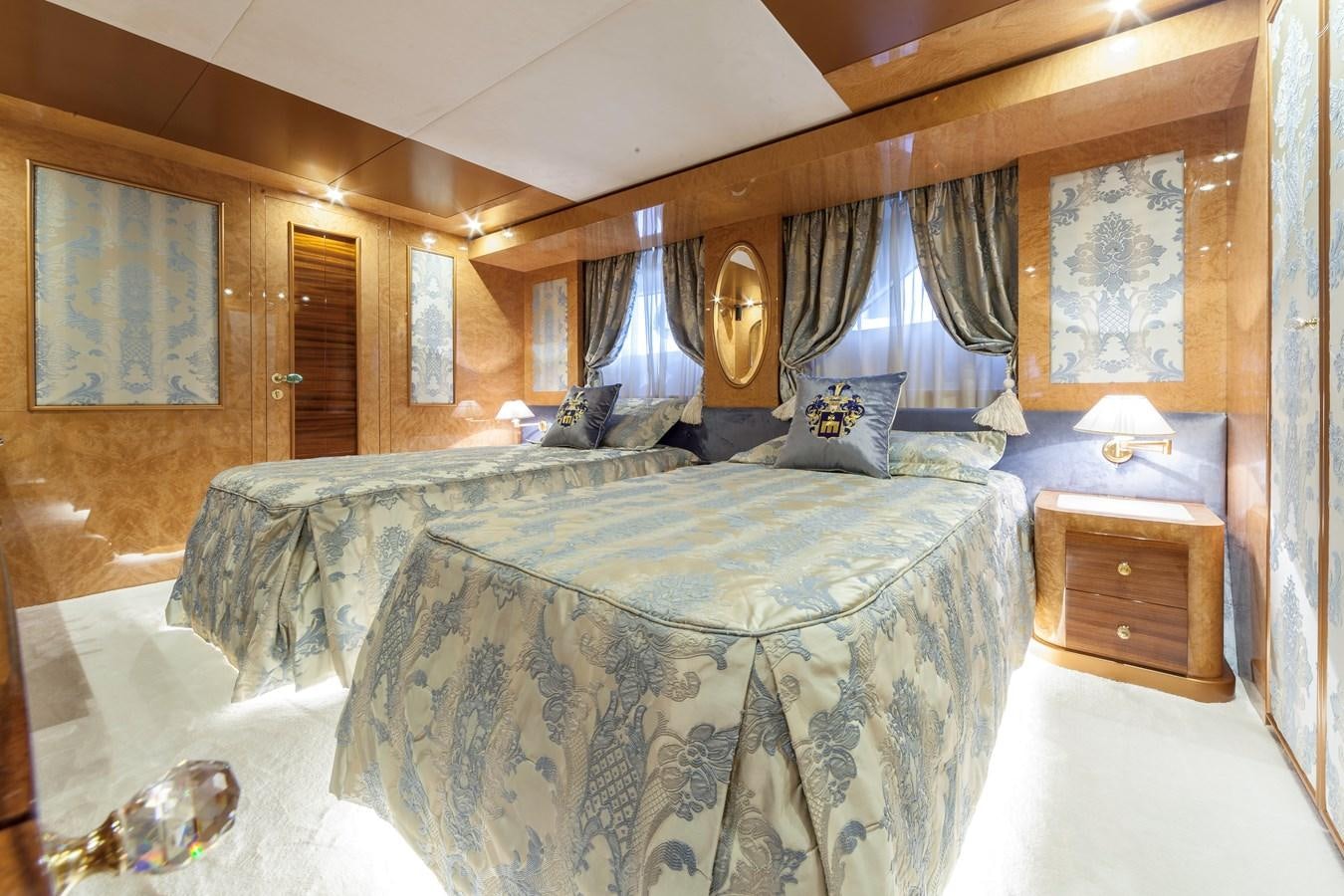 a large bedroom with a large bed aboard DUCHESSA Yacht for Sale