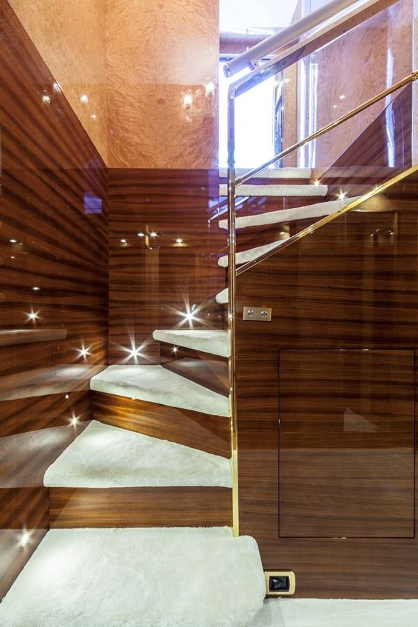 a wooden staircase with wooden walls aboard DUCHESSA Yacht for Sale