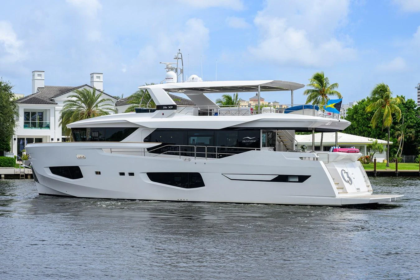a white yacht docked aboard C3 Yacht for Sale