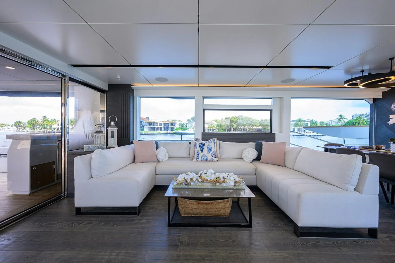 a living room with a large window aboard C3 Yacht for Sale