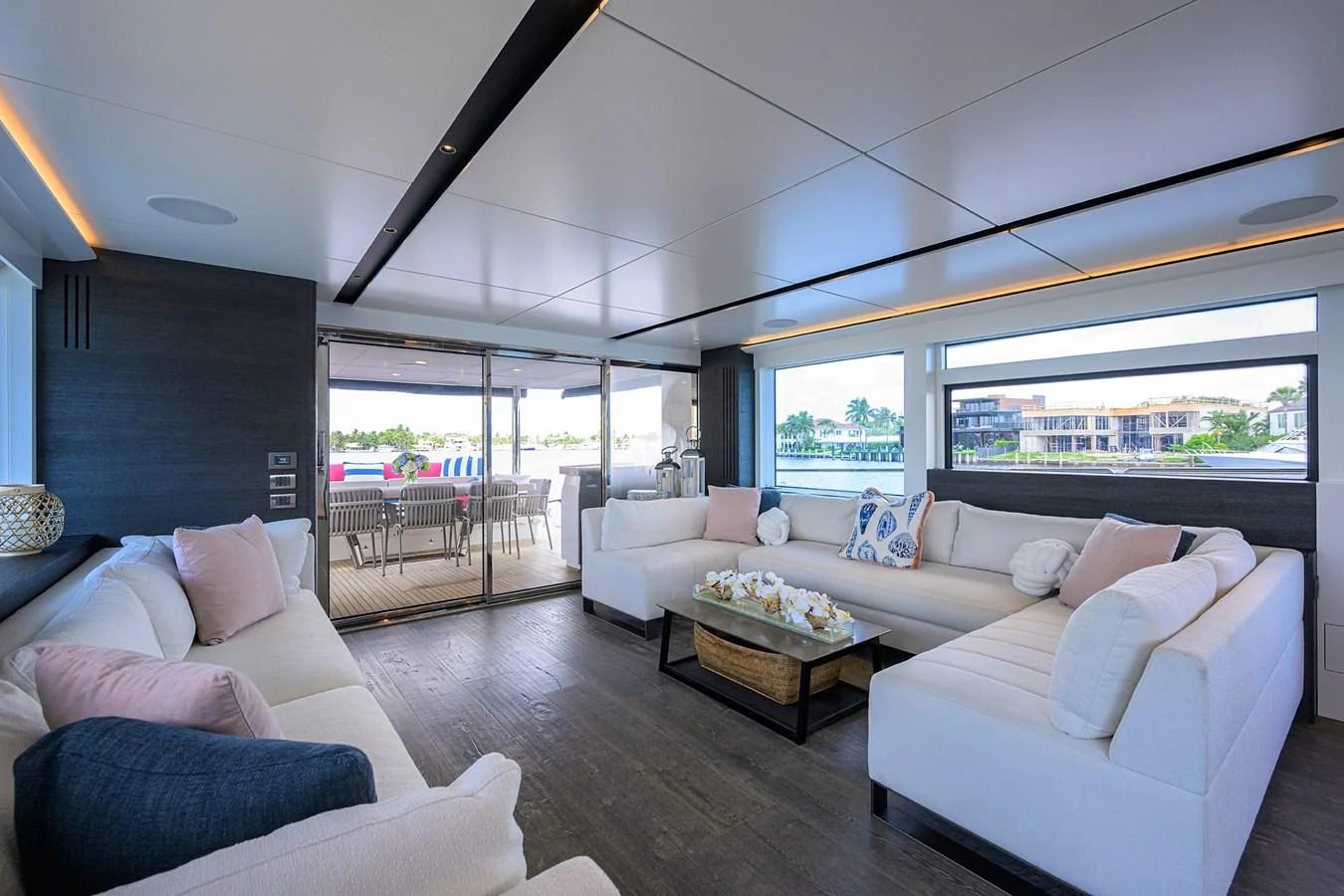 a living room with a large window aboard C3 Yacht for Sale