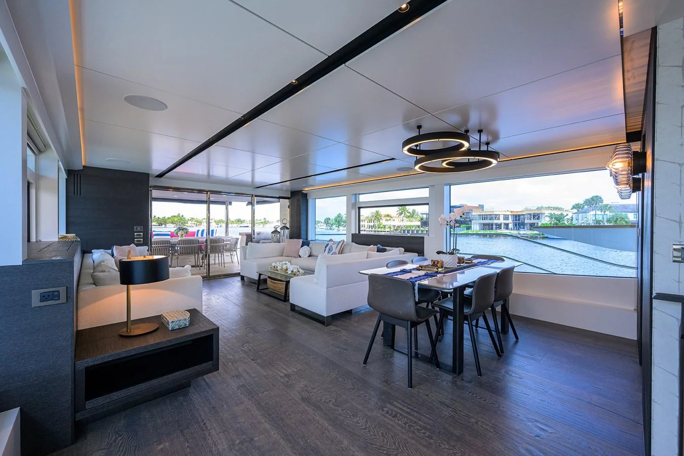 a living room with a large window aboard C3 Yacht for Sale