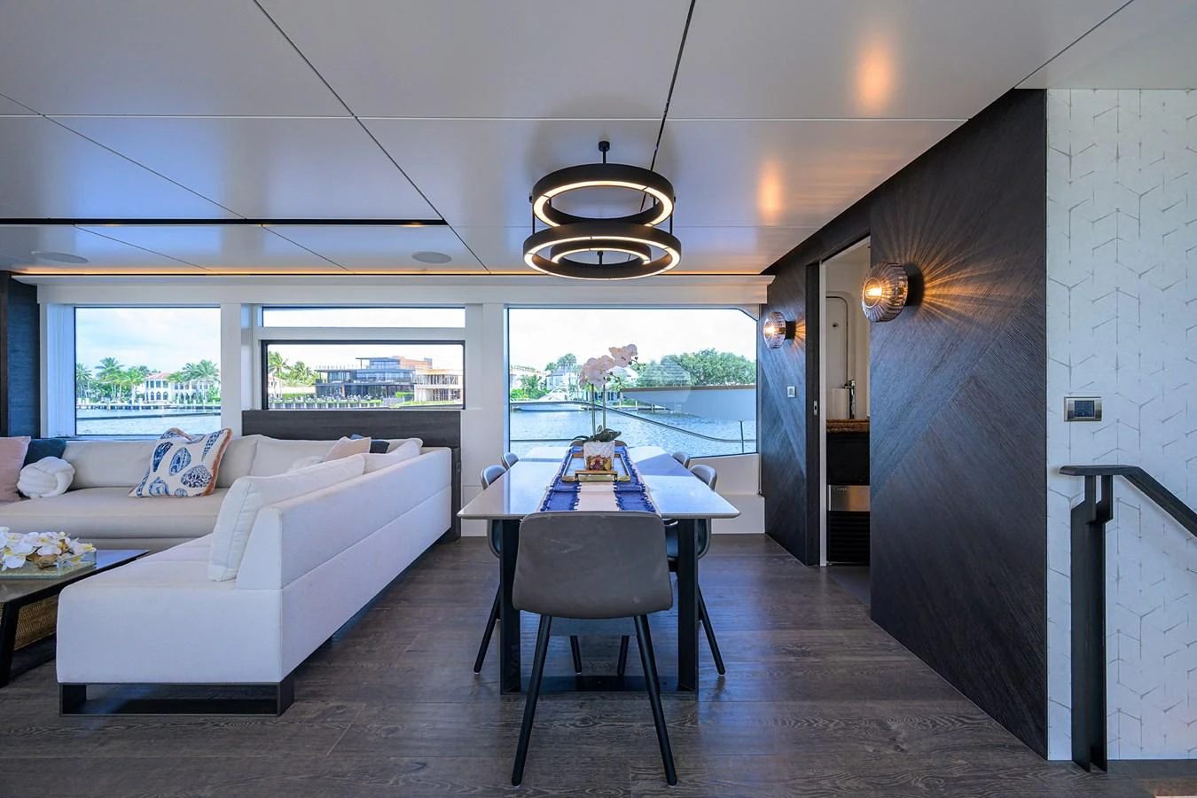 a room with a couch and a table aboard C3 Yacht for Sale