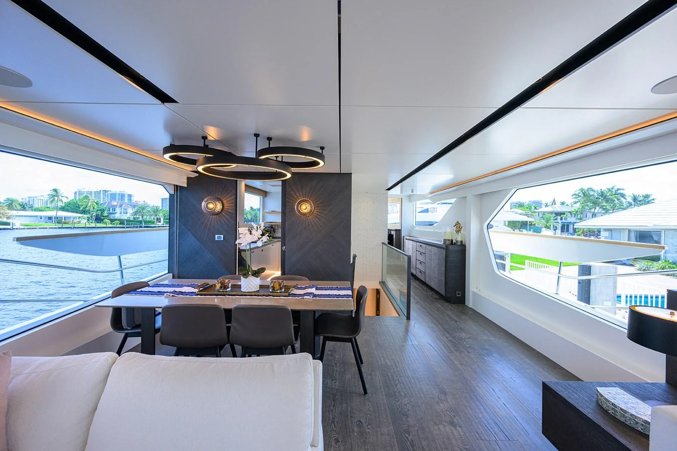 a room with a table and chairs aboard C3 Yacht for Sale