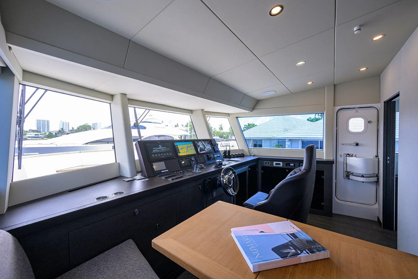 inside of a vehicle with a desk and computer aboard C3 Yacht for Sale