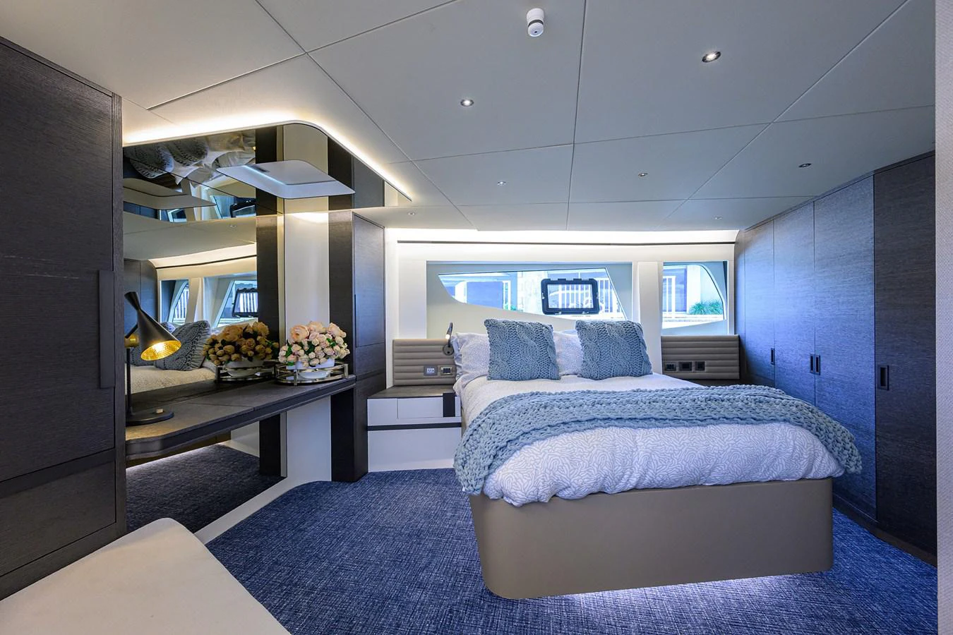 a room with a bed and a desk aboard C3 Yacht for Sale
