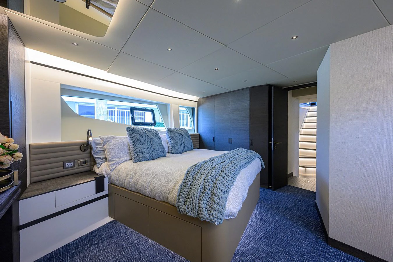 a bedroom with a bed and a staircase aboard C3 Yacht for Sale