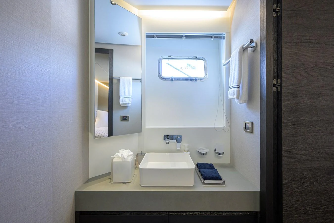 a bathroom with a sink and a mirror aboard C3 Yacht for Sale