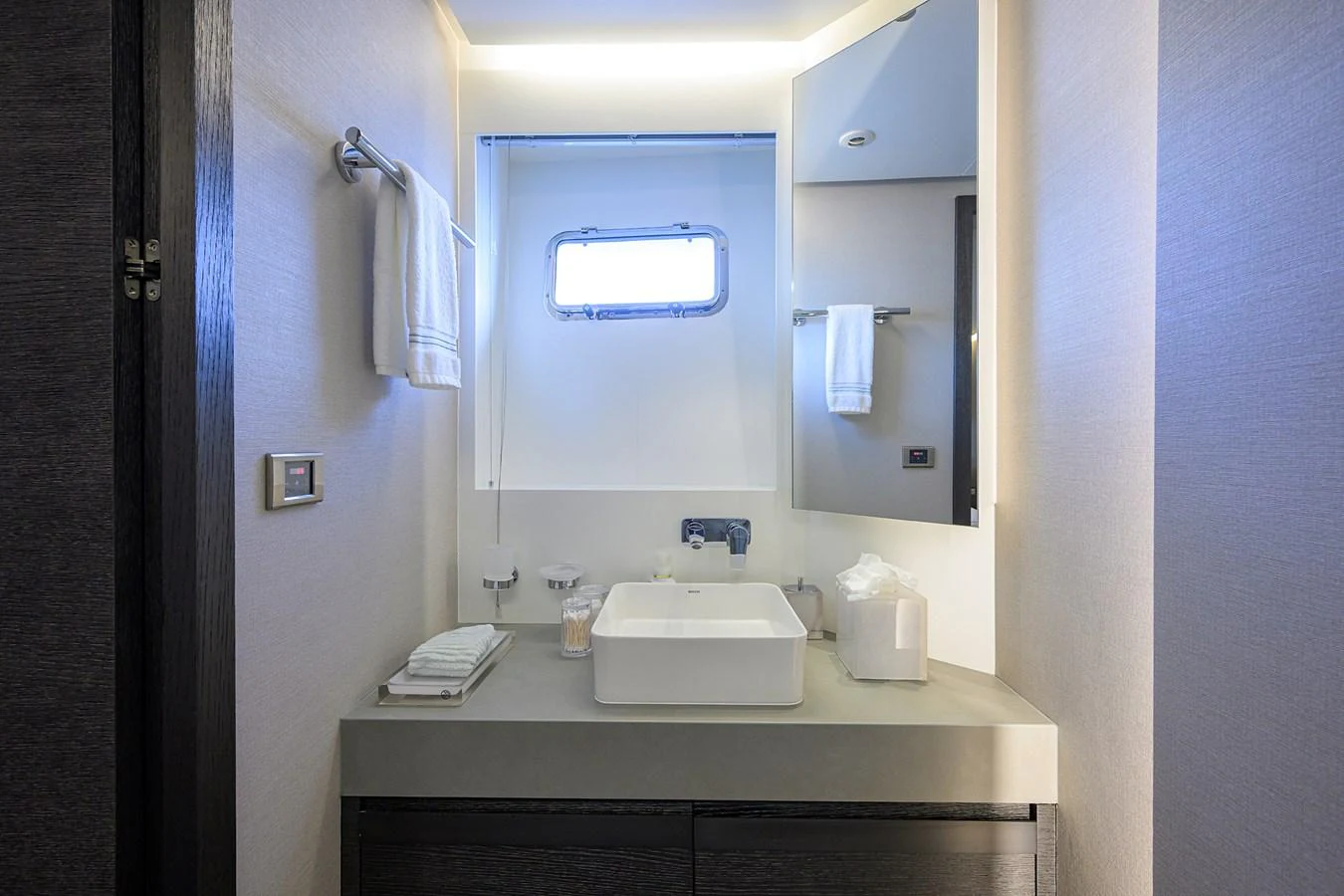 a bathroom with a sink and mirror aboard C3 Yacht for Sale