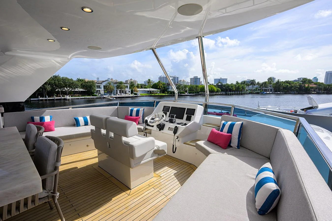 a large living room with a large balcony overlooking a body of water aboard C3 Yacht for Sale