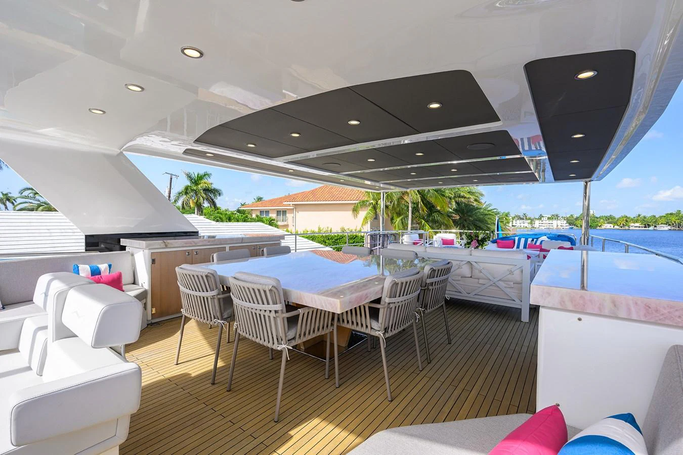 a room with tables and chairs aboard C3 Yacht for Sale