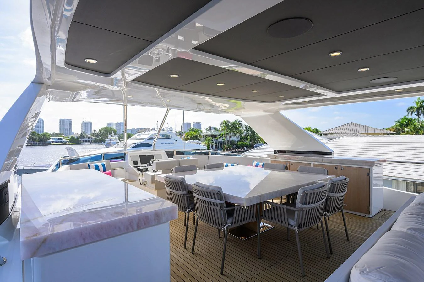 a room with tables and chairs aboard C3 Yacht for Sale
