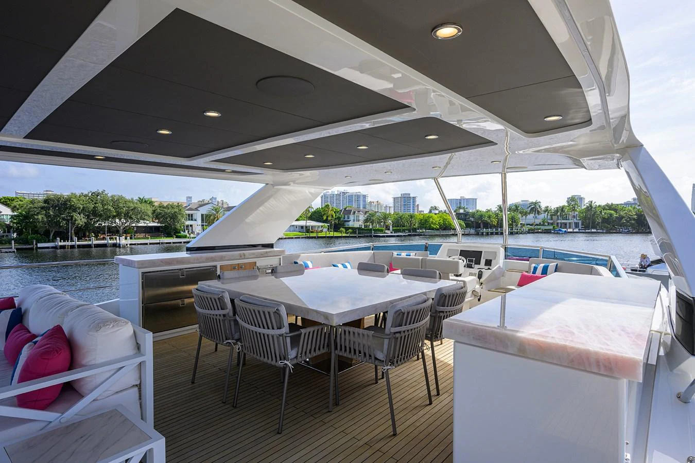 a room with tables and chairs aboard C3 Yacht for Sale