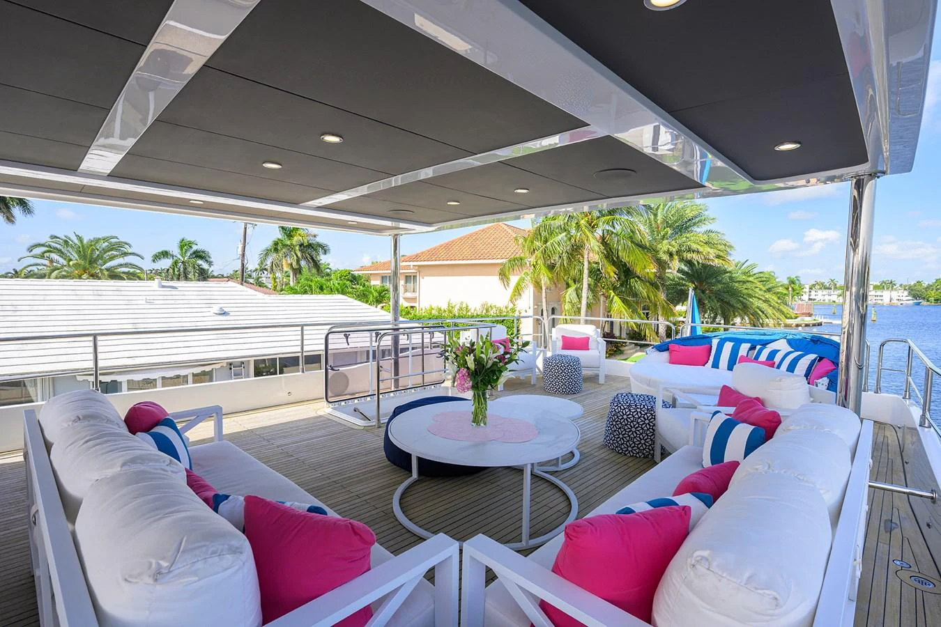 a deck with a table and chairs aboard C3 Yacht for Sale
