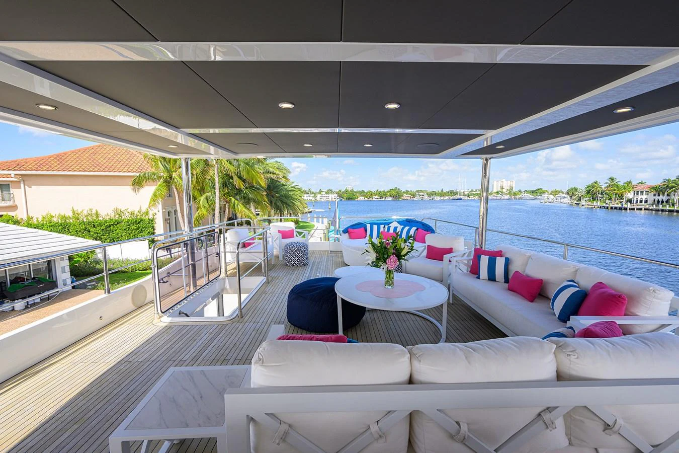 a deck with a pool and a deck with chairs and a deck aboard C3 Yacht for Sale